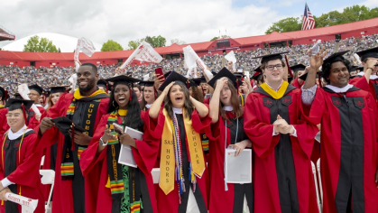 Rutgers graduates during commencement in their regalia