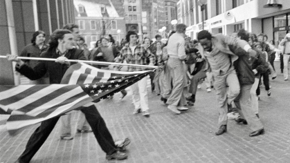 Historic image of white protester attacking Black man in 1976