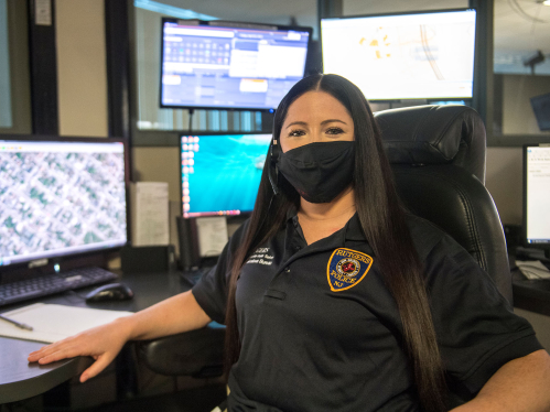 Jennifer Downey sits at a 911 dispatch center for the Rutgers Police Department