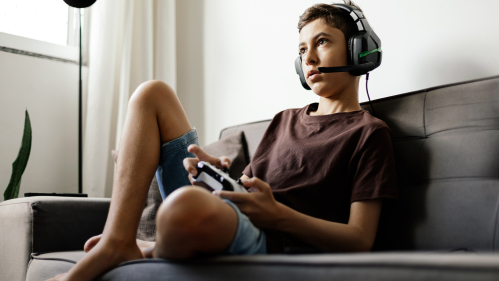 Teen playing video game