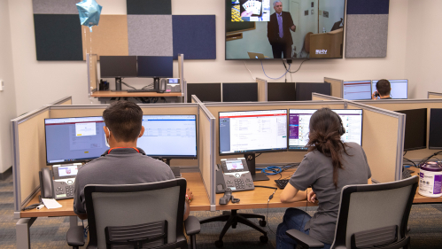 Consultants handle IT questions over the phone in new OIT Help Desk facilities, located in Davidson Hall on the Busch campus.