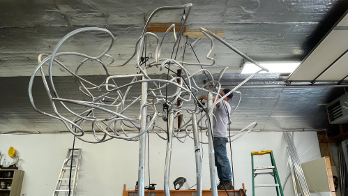 Patrick Strzelec, professor emeritus at the Mason Gross School of the Arts, works on the sculpture "Past is Prologue" in his Carversville, Pa., studio.