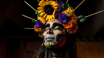 photo of woman in Dia de los Muertos costume