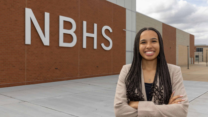 Rutgers University-New Brunswick student Ashley Caldwell stands outside New Brunswick High School.