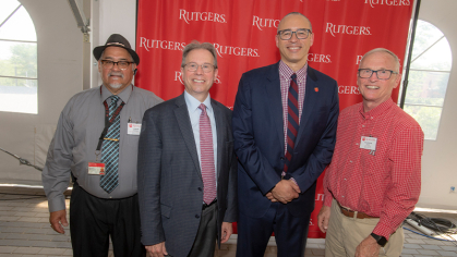 President Jonathan Holloway poses with staff members with 40 years of service Orlando Rodriguez, Chief Operating Engineer, Institutional Planning and Operations, Joseph Barone, Dean, Ernest Mario School of Pharmacy and Gary Michael Kucsan, Associate Director, University Procurement Services.