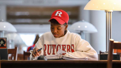 Rutgers Newark student sitting at a desk and working 