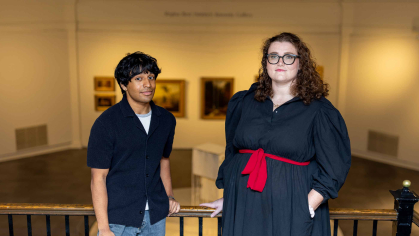 Rutgers students Roshan Kenath (left) and Megan Mauriello stand in the Art of the Americas Gallery at the Zimmerli Art Museum.