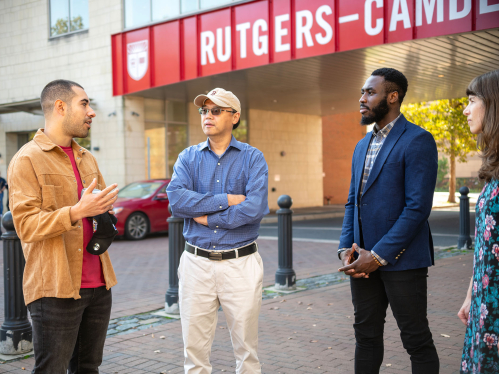 Rutgers Camden students talking outside