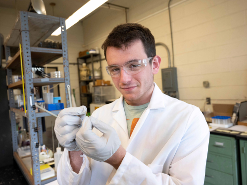 Dante Magliaccio working in an engineering lab on campus