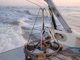 grab sampler on the deck of a boat