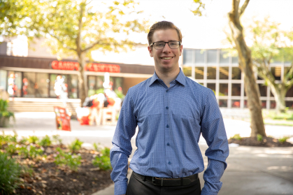 Matthew Broadsky standing at the Camden Campus Quad