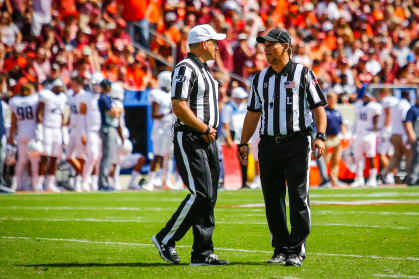 Steve Matarante conferring with fellow official Duane Heydt