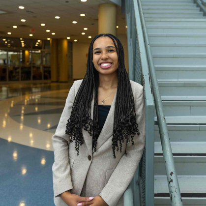 Rutgers University-New Brunswick student Ashley Caldwell poses next to a flight of stairs in New Brunswick High School.