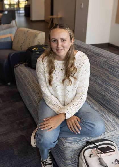 Alyssa Nielsen smiles for the camera at the Rutgers Center for Adult Autism Services.