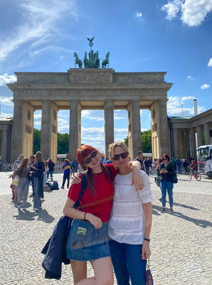 Kate Beemer (left) and her mother Ruth, who was born and raised in Bonn, Germany, pose in front of the Brandenburg Gate, a monument in Berlin.