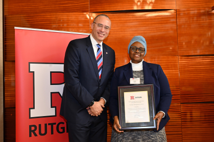 President Jonathan Holloway with Emilia Iwu, Clinical Associate Professor and Assistant Dean at the Center for Global Health, honored with the Rutgers Outstanding Service Award-Individual.