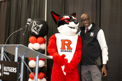 Rutgers University - Newark interim chancellor Jeffrey A. Robinson with the campus’ new mascot