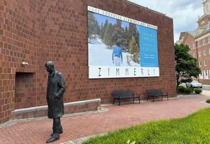 A banner outside the Zimmerli Art Museum promotes the "Smoke & Mirriors" exhibition.